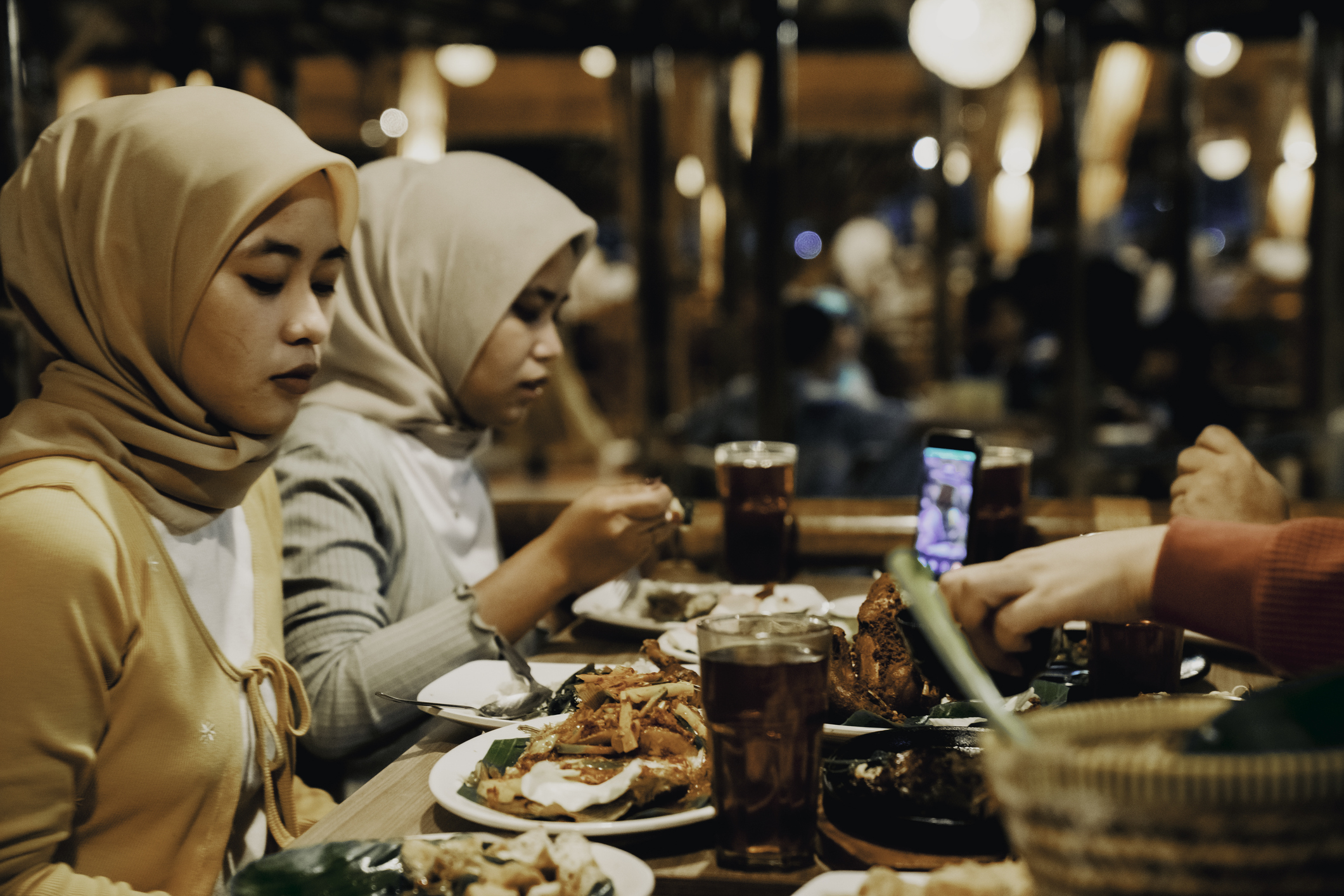 two woman enjoying dinner in a restaurant